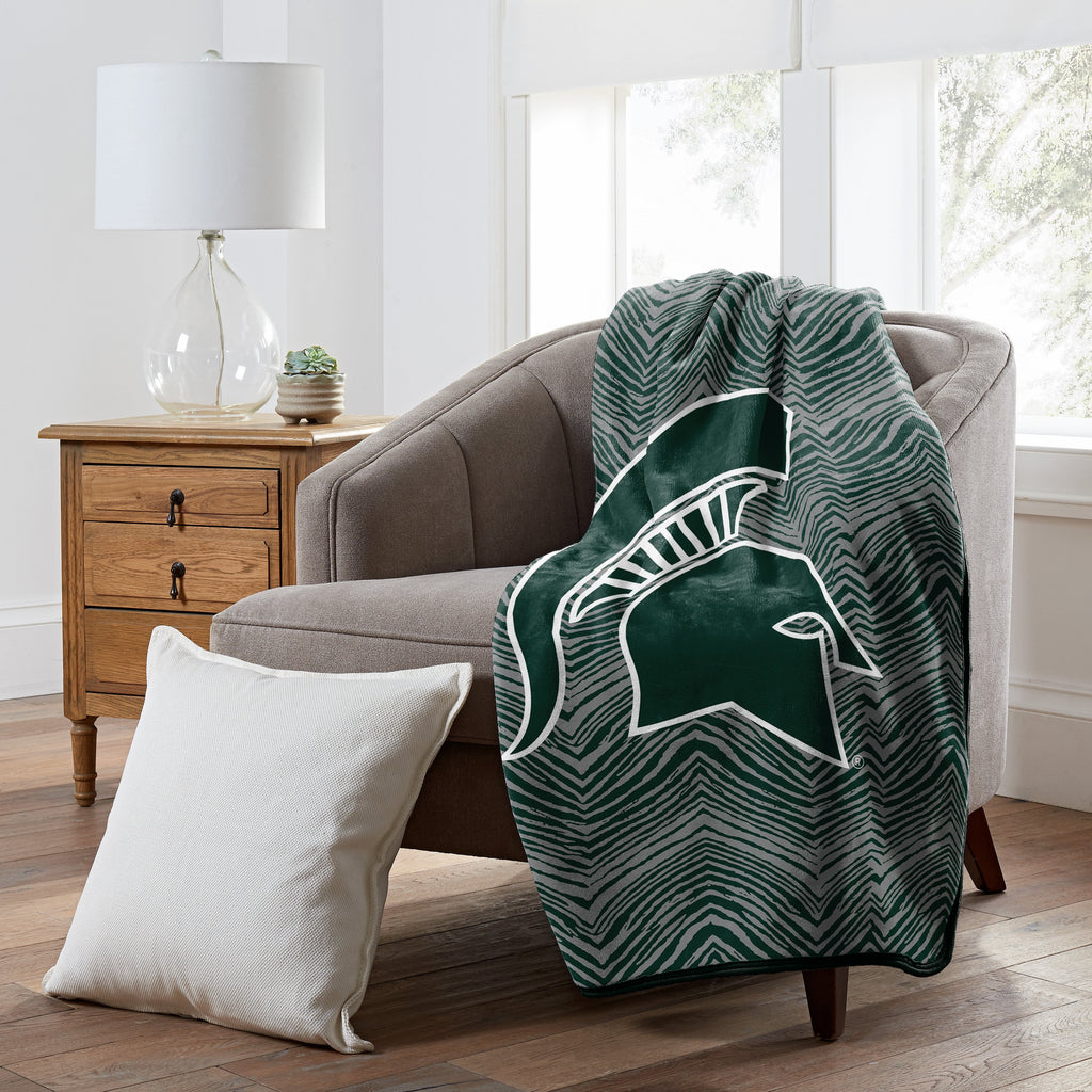 Zubaz x Northwest NCAA Michigan State Spartans Zubified Raschel Throw Blanket