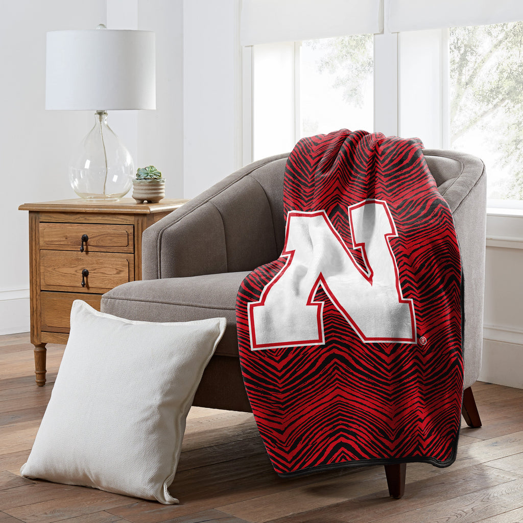Zubaz x Northwest NCAA Nebraska Cornhuskers Zubified Raschel Throw Blanket